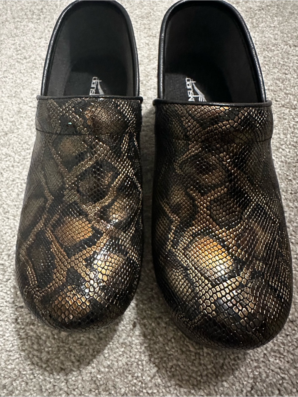 Dansko Women’s Slip-On Clogs in Metallic Brown Snakeskin